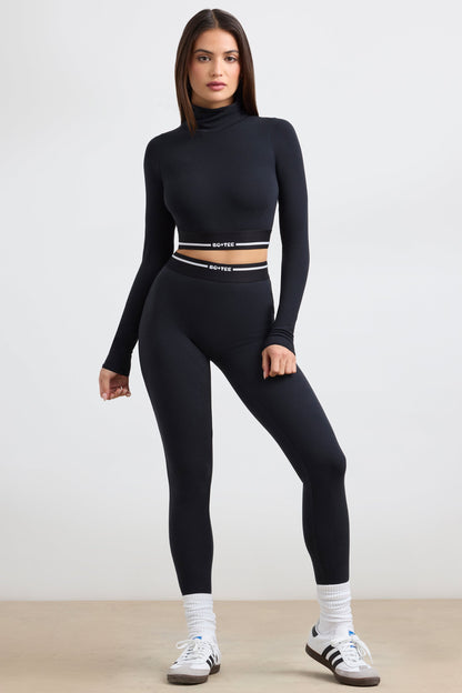 Stretch Cotton Jersey Backless Turtleneck Long-Sleeve Crop Top in Black