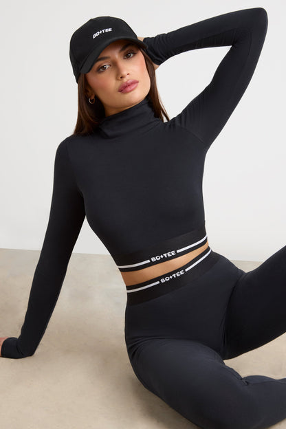 Stretch Cotton Jersey Backless Turtleneck Long-Sleeve Crop Top in Black